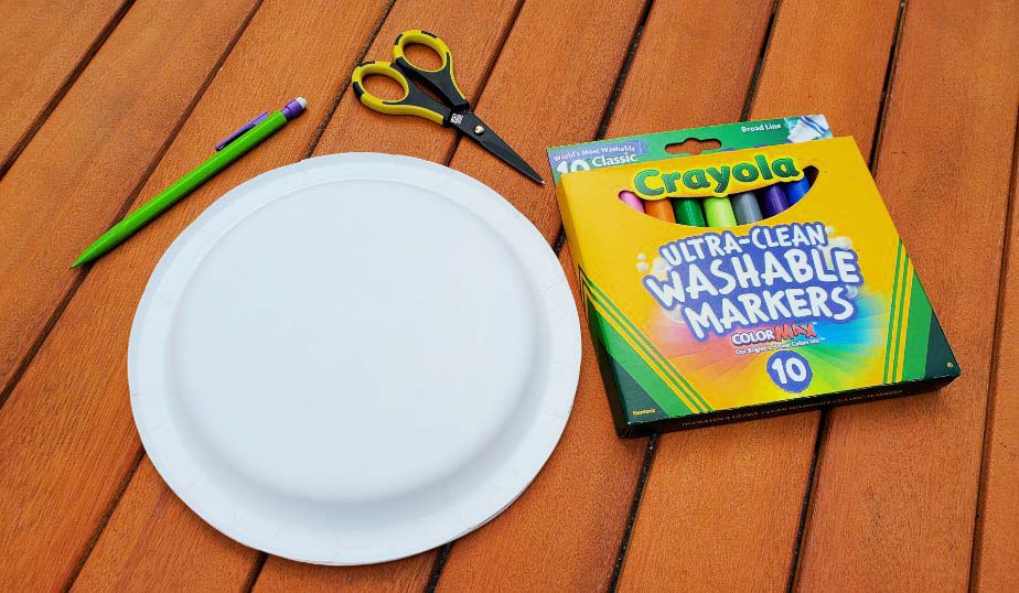 flat lay of the supplies for paper plate flying saucer diy activity for kids